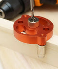 Boss Grade Self Centering Doweling Jig Kit With Knockout Wood Drill Guide and Tight Alignment Hole Locator, lightweight aluminum, close-up view of drill setup.