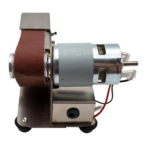 Knockout Mini Belt Sander And Slick Dual Voltage Polisher with tough grinding wheel and 775 motor, side view highlighting components.
