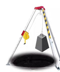 Heavy Duty Rescue Tripod For Confined Spaces Rock Solid Fall Protection Stand with industrial hoisting winch and weight over a deep opening.