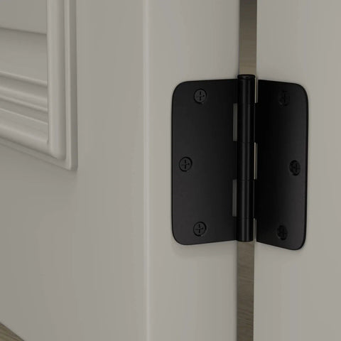 Close-up of Six Pack Matte Black Interior Door Hinges Three Point Five Inch By Three Point Five Inch With One Quarter Inch Radius Corners