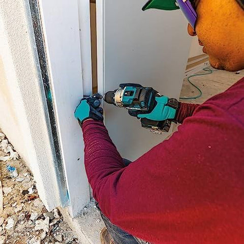 Person using 18V LXT Brushless Compact Hammer Drill Driver One Half Inch Cordless Tool Only, 970 Inch Pounds Max Torque, Longer Run Time Per Charge on door frame