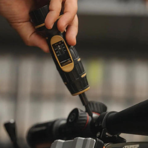 Manual Firearms Torque Wrench With Inch-Pounds Readout in use for gunsmithing and scope mounts adjustment on a firearm