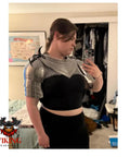 Person wearing Gothic Steel Gorget With Pauldrons Shoulder Guard Set For LARP And SCA Knights, silver medieval armor, indoors.