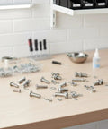 320 Piece Small Metric Machine Screws Set With Nuts And Washers, M2 To M5, Includes Lock And Flat Washers spread on a workbench
