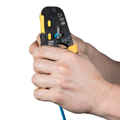 Hands using RJ45 Cable Tester Kit With LAN Scout Jr 2 All In One Coax Crimper Stripper And Cutter Tool on a blue cable