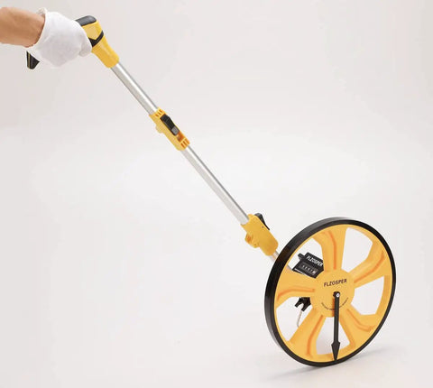 Smooth Rolling Measuring Wheel With Durable Rubber Tire And Mechanical Counter For Nailing Yard Surveys Up To Nine Thousand Nine Hundred Ninety Nine Feet Light Alloy Frame Collapses Fast For Zero Fuss Stashing In Bright Yellow