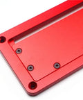 Close-up of a flip adjustable aluminum table saw throat plate with red finish, precise fit for circular saws.