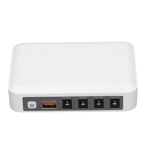 Solid Mini Ups With Six Thousand Mah Battery To Keep Your Wifi Router And Modem Running Smooth Through Power Blackouts And Internet Downtime Without A Hitch At Home Or Office, compact white unit with multiple output ports.