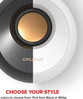 Top view of Pebble 2.0 USB Powered Desktop Speakers with Far-Field Drivers, showcasing split black and white design.
