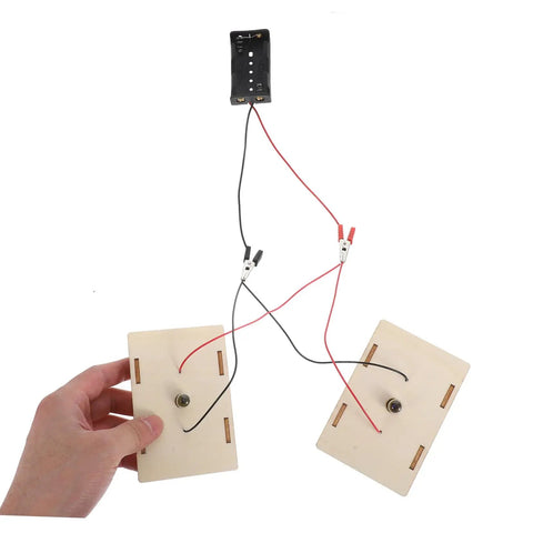 Hands On Circuit Board Kit For Young Experimenters Electrical Circuit Building Set components with wires and wooden boards.