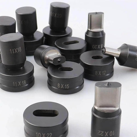 Various sizes of oval punch dies for hydraulic machines, including Oval Hole Punch Die For CH-70 Hydraulic Punching Machine, displayed on a surface.