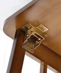 Built Tough Black Folding Table Hinge Featuring Automatic Self Locking Brackets For Heavy Duty Sofa Beds And Coffee Tables Zero To Ninety Pivot Galvanized Steel Hardware Kit on wooden table.