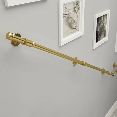 Heavy Duty Wrought Iron Handrail For Stairs Indoors And Outdoors, smooth gold tone wall support mounted on gray wall.