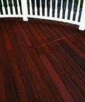 Top Shelf One Coat Wood Stain And Sealer For Pressure Treated Decks Fences Exterior Wood Surfaces semi-transparent rich black hue on wooden deck