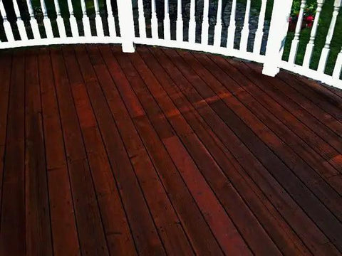 Top Shelf One Coat Wood Stain And Sealer For Pressure Treated Decks Fences Exterior Wood Surfaces semi-transparent rich black hue on wooden deck