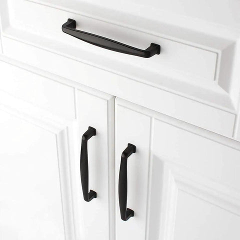 10 Pack 5 Inch Matte Black Cabinet Pulls And Drawer Handles Heavy Duty Solid Metal Kitchen Hardware Featuring Smooth Rounded Corners on white cabinet.