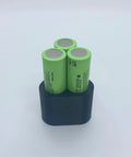 Top Rated Effortless Welding Clamp Fixture Set For Battery Pack Spot Crafting showing three green lithium cells in a black holder.