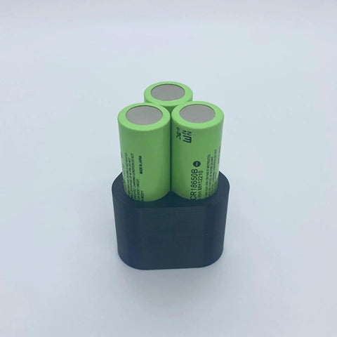 Top Rated Effortless Welding Clamp Fixture Set For Battery Pack Spot Crafting showing three green lithium cells in a black holder.