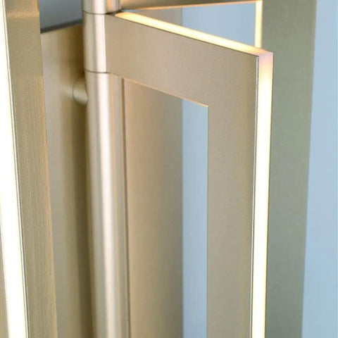 Slick Modern Wall Sconce With Asymmetrical Fan Frame LED Light Featuring Water Mill Inspired Gold Finish close-up view showing frame detail.