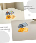 Four Piece Miniature Dollhouse Platter Set With Realistic Four Grid Resin Box For Candy And Nuts on a white tabletop