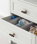 10 Pack Champagne Bronze And Matte Black Zinc Cabinet Knobs on white dresser drawers enhancing functionality.