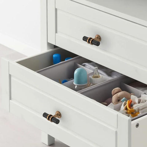 10 Pack Champagne Bronze And Matte Black Zinc Cabinet Knobs on white dresser drawers enhancing functionality.