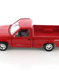 Side view of Chevy 454SS 1992 Red Diecast Pickup Truck One Twenty Fourth Scale with open tailgate on white background