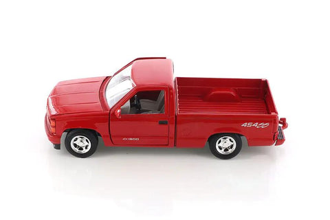 Side view of Chevy 454SS 1992 Red Diecast Pickup Truck One Twenty Fourth Scale with open tailgate on white background