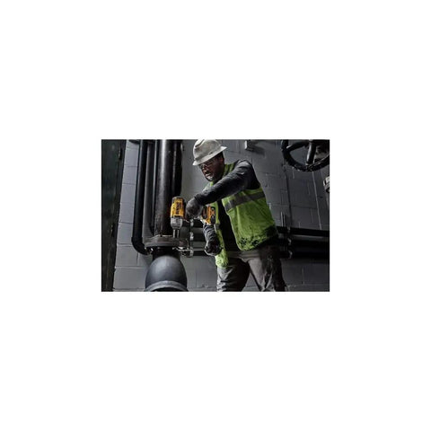 Worker using Cordless 20V Max XR Half Inch High Torque Impact Wrench Kit with hog ring anvil on industrial pipe