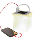 Two In One Solar Camping Lantern And Phone Charger Inflatable LED Light for camping hiking travel emergency, connected to a phone