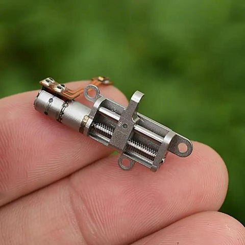 Mini 5mm Stroke Linear Actuator 2 Phase 4 Wire Stepper Motor With Precision Metal Gearbox in hand, showcasing compact design.