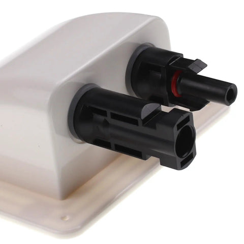 Side view of ABS UV Resistant Dual Cable Entry Housing For Solar Projects Waterproof Box With Photovoltaic Connector Ideal For RV Boat Camper Van Weatherproof White Entry Gland, featuring black connectors