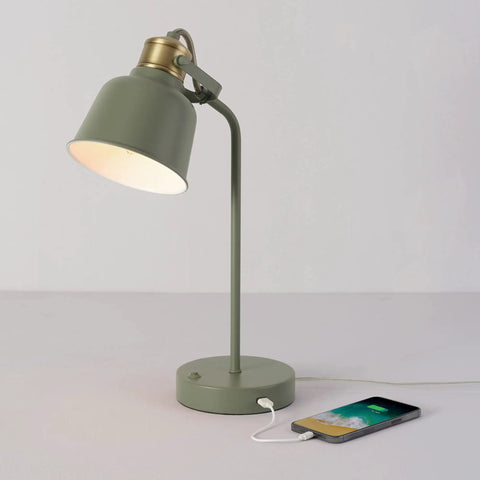 Lofty Industrial 18 Inch Desk Lamp With 2.1 USB Port in matte sage green and brass accents on desk with phone charging