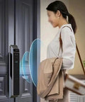 Hassle Free Smart Door Lock With Rock Solid Fingerprint Recognition And Swipe Card Keyless Entry Smooth Brushed Steel Look mounted on a door with user.