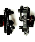 Hardcore Mountain Mechanical Disc Brake Kit With Front And Rear Calipers And Pro Levers Features Rapid Mount Setup And Tight Cable Routing For Sure Fire Stops And Crazy Control, showing black metal calipers.