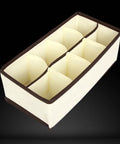 Top Tier Setup For Messy Drawers This Foldable Beige Drawer Organizer with Eight Generous Compartments for Socks and Underwear.