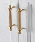 2 Pack Solid Brass Cabinet Pulls 5 Inch Hole Centers Gold Knurled Textured Bar Handles installed on white cabinet doors