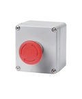 Metal push-button control box with red emergency start/reset knob on a gray enclosure