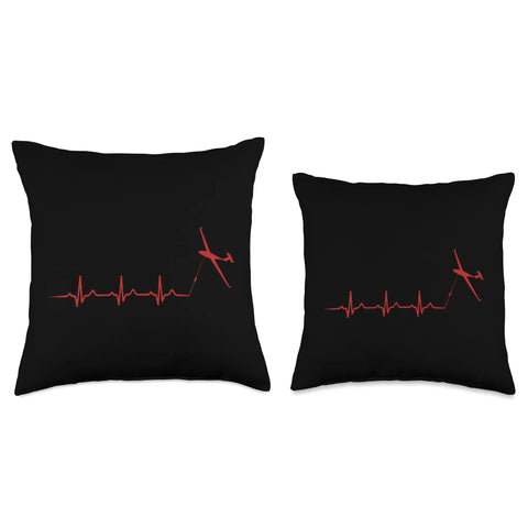Two black throw pillows featuring red heartbeat and glider plane design, perfect for airshow fans and flight lovers.