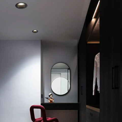 Top Shelf Sleek Led Recessed Lights With Zero Hassle Install And Adjustable Three Way Color Temps For Crisp Full Spectrum Glow Featuring Rugged Anti Rust Aluminum Housing And Anti Glare Baffle Trim In 14 Pack illuminating a modern dressing area.