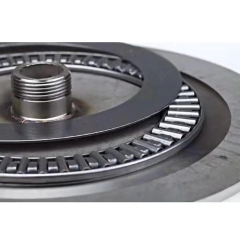 Close-up of Tempered Glass Round Dining Table Lazy Susan Turntable mechanism, showcasing metal bearings for smooth rotation.