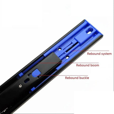 Close-up of push to open drawer slide with ball bearing, black metal track, showcasing rebound system details.