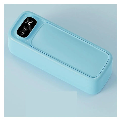 Portable Ultrasonic Cleaner For Jewelry Eyeglasses Retainers And Watches Pink Multifunctional Cleaning Gadget that is light blue and compact.