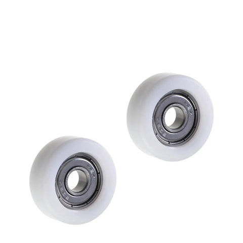 Four Pack Heavy Duty Nylon Roller Idler Bearing Pulleys Running Smooth As Butter With Round Groove Design For Quiet Sliding Cabinet Doors And Furniture Hardware Jobs Built Tough For Everyday Use - close-up of two durable nylon wheel rollers.