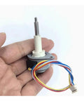 Hand holding 25mm Precision Linear Actuator for Stepper Motors, 20mm Stroke, with wires visible