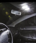 Interior view of a 2007-2017 Mitsubishi Lancer Evo with map lights from Interior LED Bulbs Kit For 2007 2017 Mitsubishi Lancer Evo 6 Piece Set Includes Map Lights Dome Lights Trunk Lights And License Plate Lights With 6000K Bright White LED Plus Free Install Tool