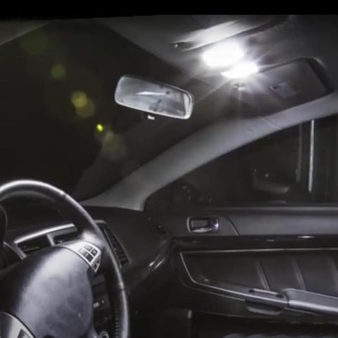 Interior view of a 2007-2017 Mitsubishi Lancer Evo with map lights from Interior LED Bulbs Kit For 2007 2017 Mitsubishi Lancer Evo 6 Piece Set Includes Map Lights Dome Lights Trunk Lights And License Plate Lights With 6000K Bright White LED Plus Free Install Tool