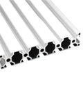 Heavy Duty T-Slot Aluminum Profile 3030 And 3060 Sizes For Custom Builds showing multiple aluminum struts with black interiors.