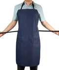 Person wearing Waterproof Rubber Vinyl Apron With Two Big Pockets For Dishwashing And Grooming Lightweight PU Workhorse Apron
