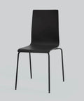Modern black dining chair with sleek metal legs on a light gray background